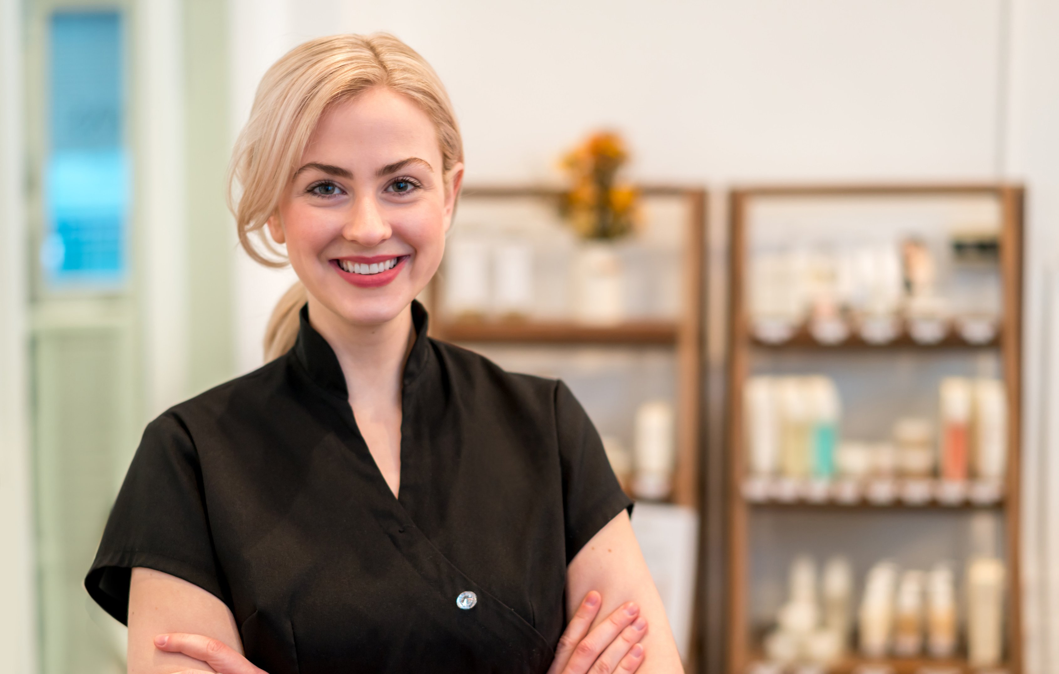 Happy business owner working at a spa