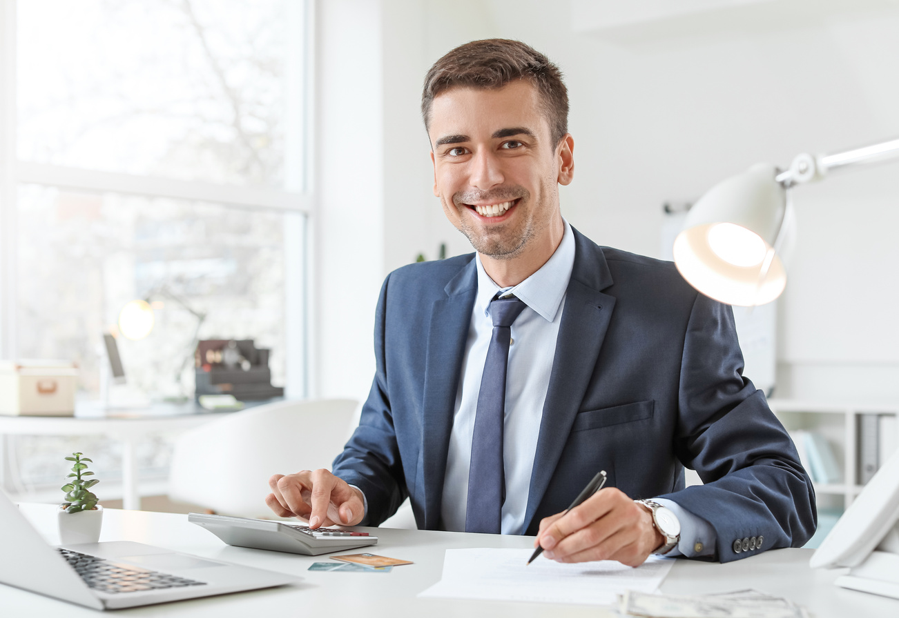 Male Bank Manager Working in Office