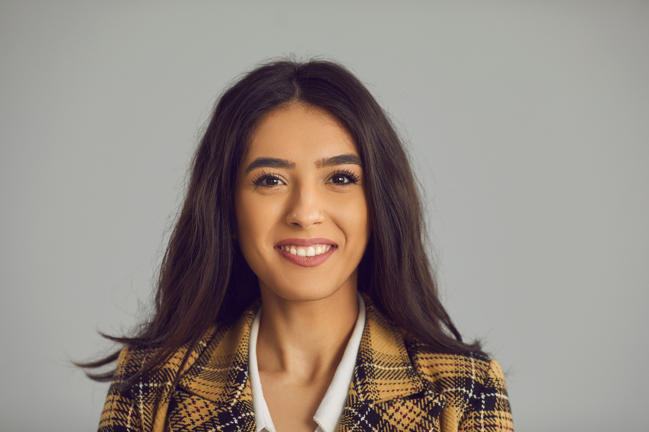 Headshot Portrait of Attractive Millennial Hispanic Woman Isolated on Copy Space